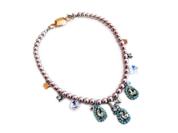 Beaded Necklace With Light Blue Rhinestones, Silver Plated Brass and Small Charms.